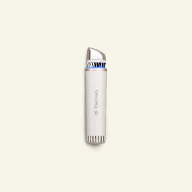 White electronic device with silver top on a beige background
