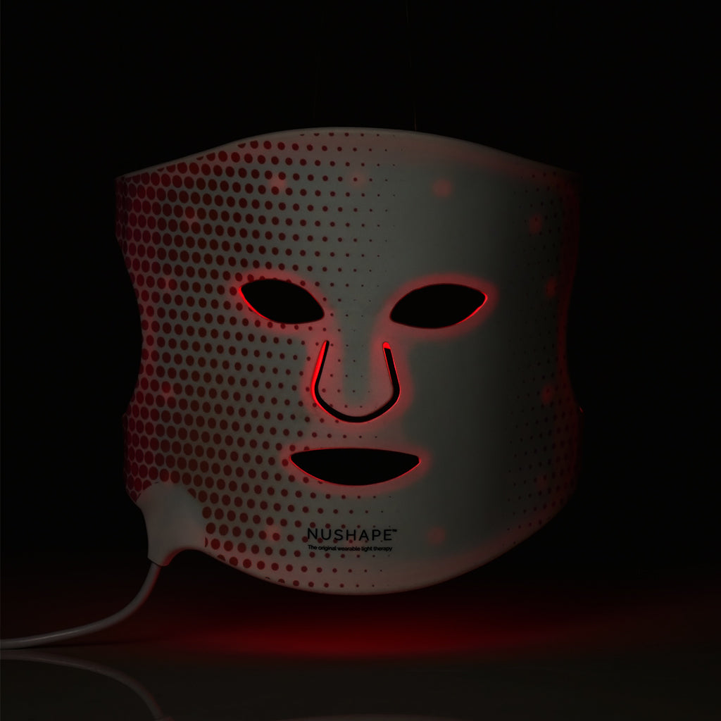NuShape red light therapy face mask in dark