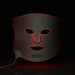 NuShape red light therapy face mask in dark