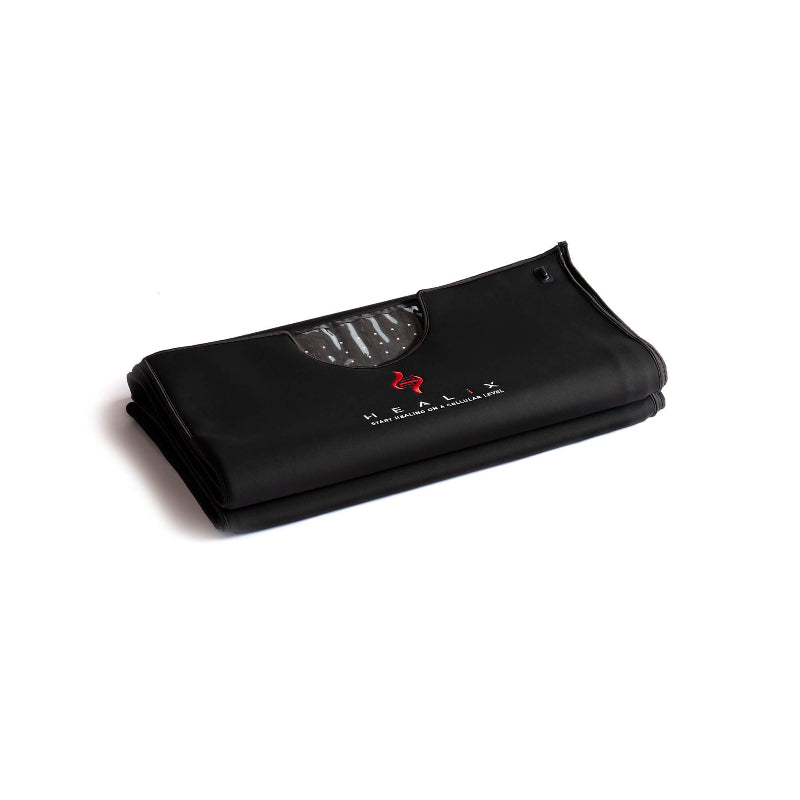 Black folded red light therapy mat on white background