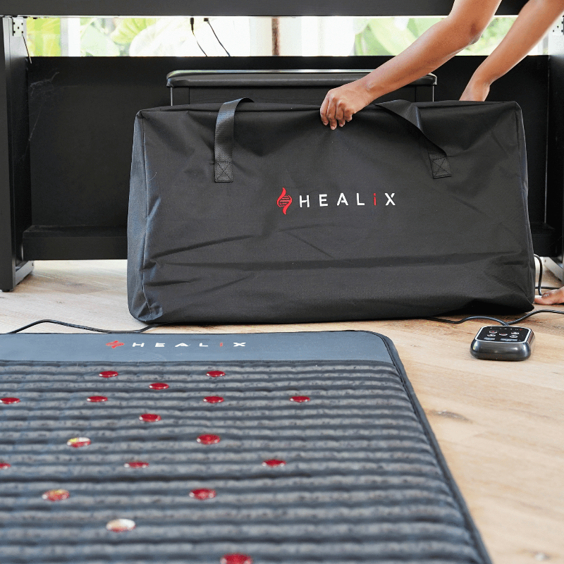 HEALIX mat and bag on a wooden floor with a window in the background