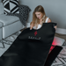 women holding red light mat on carpet