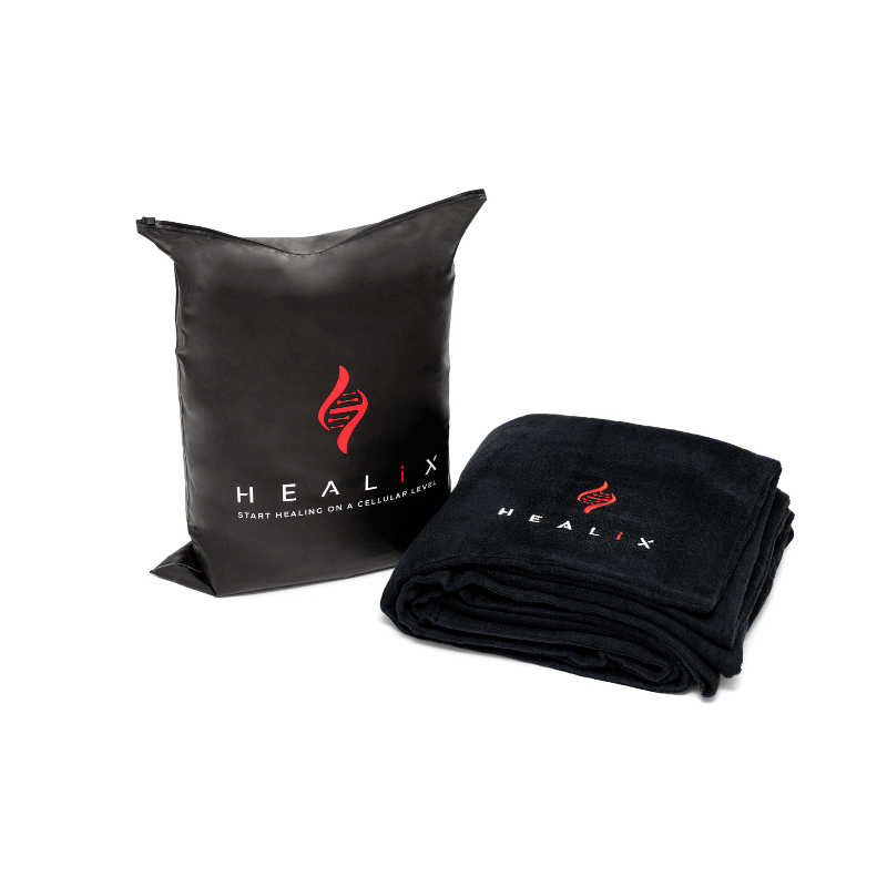 Black pillow and folded blanket with HEALIX logo on a white background