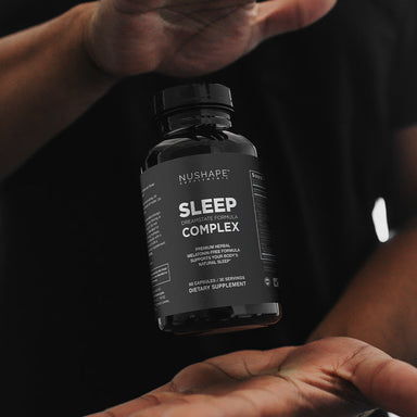 Sleep Complex: Dreamstate Formula holding bottle