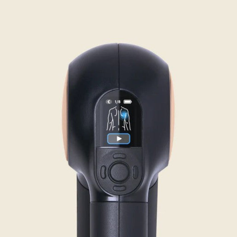 Black handheld device with digital display on a beige background