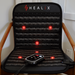 Healix red light chair pad with red lights on a wooden chair