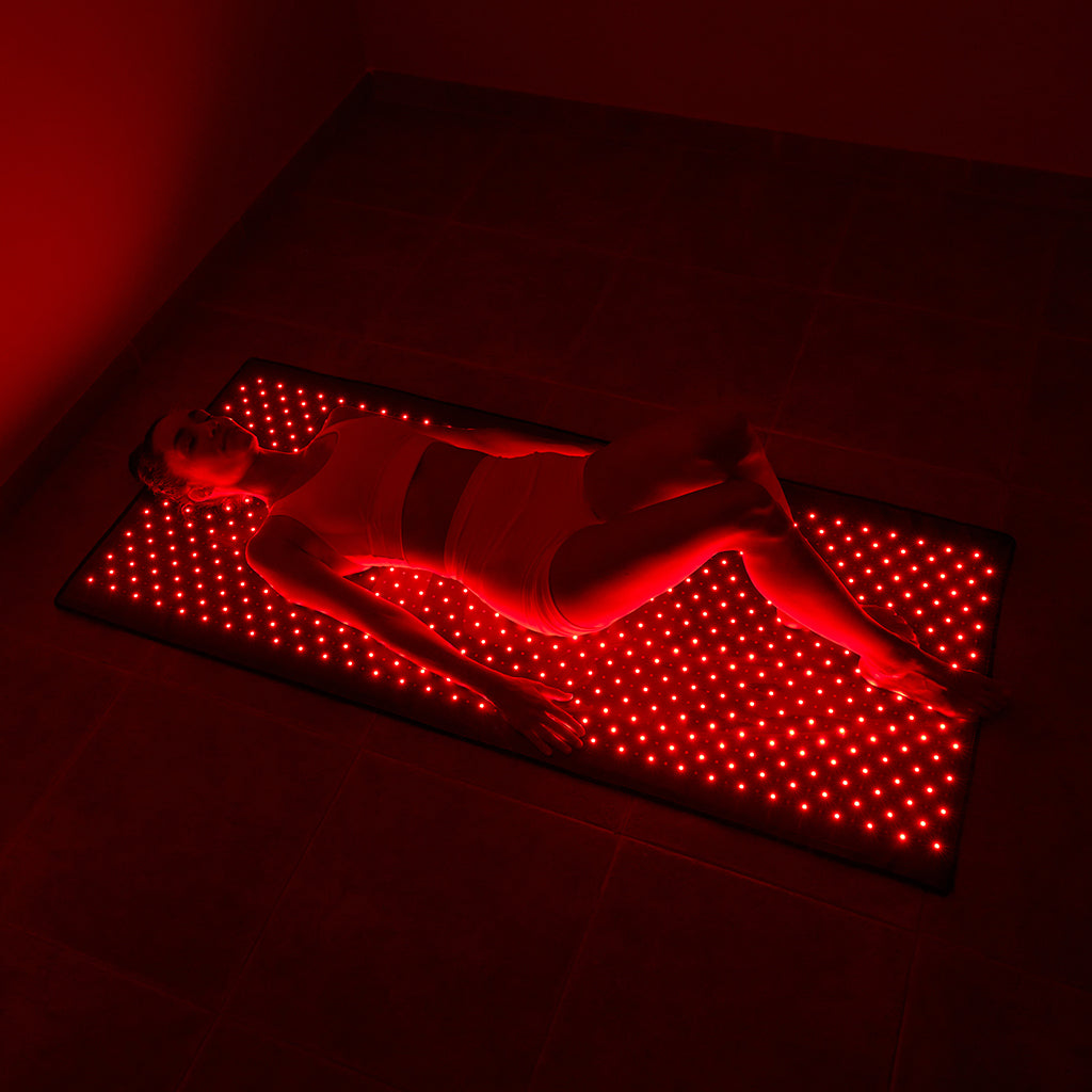 nushape red light therapy mat girl laying down