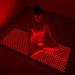 nushape red light therapy mat girl sitting full
