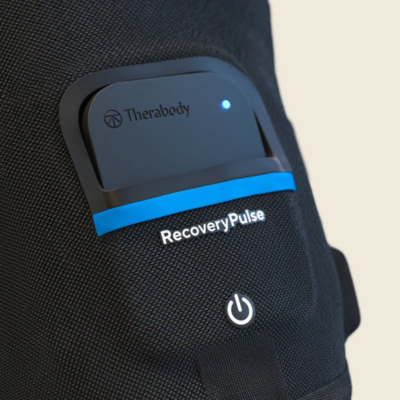 Black device with Therabody logo and 'RecoveryPulse' branding on a textured surface.