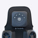 Black Therabody massage device with control panel on a light gray background