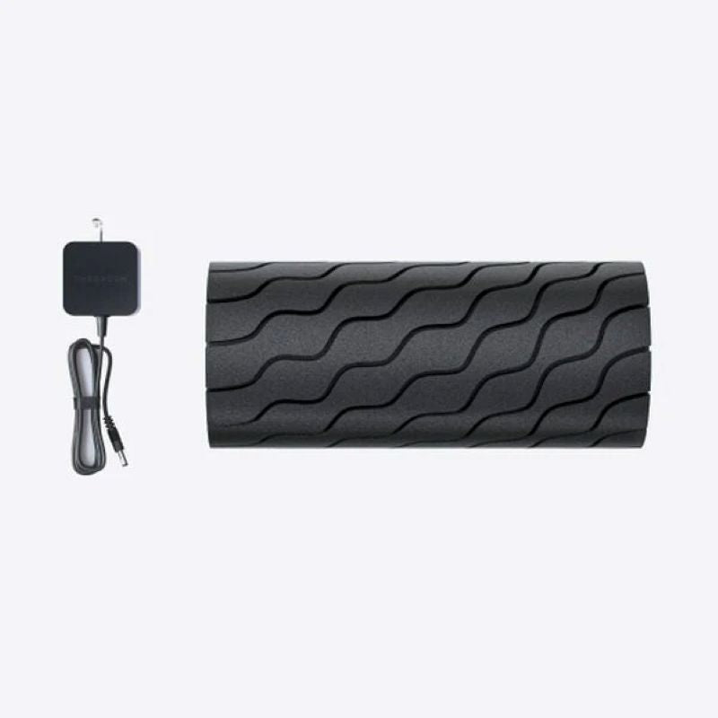 Black foam roller with wave pattern and black attachments on a white background